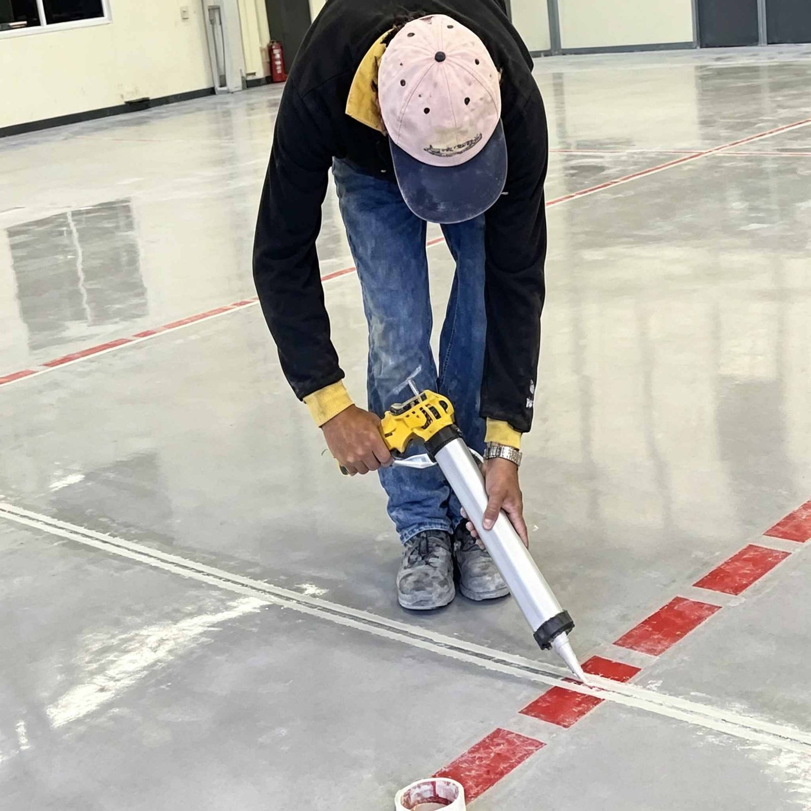 Heavy-duty industrial concrete floor joint grouting and self-leveling sealing in warehouse